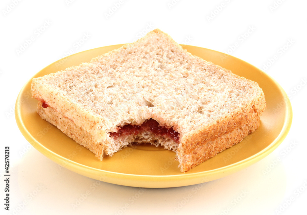 Bitten sandwich with jam on plate isolated on white Bitten sandwich with jam on plate isolated on white