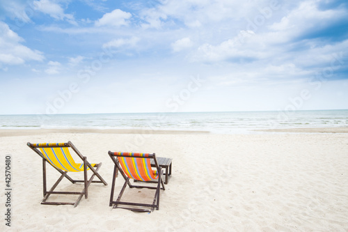 Fototapeta Naklejka Na Ścianę i Meble -  Beach chair on white sandy beach and clear sky