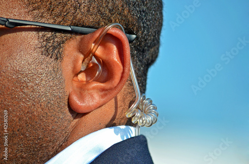 earpiece in secret service man's ear photo