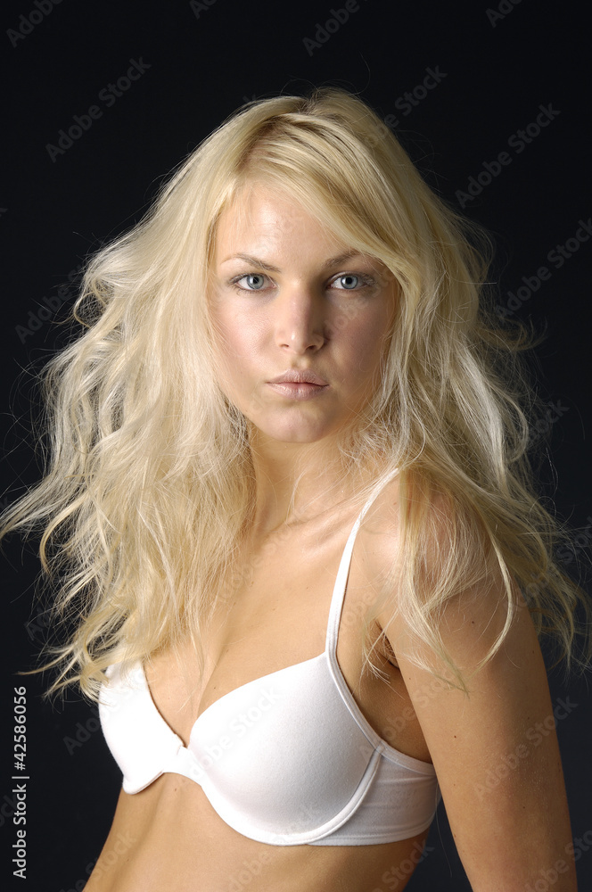 Close up sexy girl wearing white lingerie on black Close up sexy girl wearing white lingerie on black