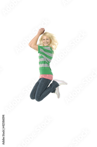 Girl jumping isolated on white
