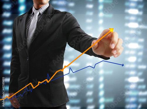 touching display screen with statistics graph and data informati photo