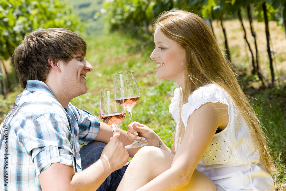 couple at a picnic in vineyard couple at a picnic in vineyard