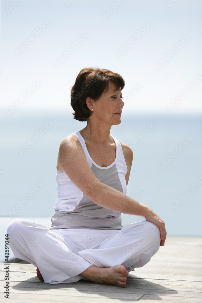 Older woman practicing yoga
