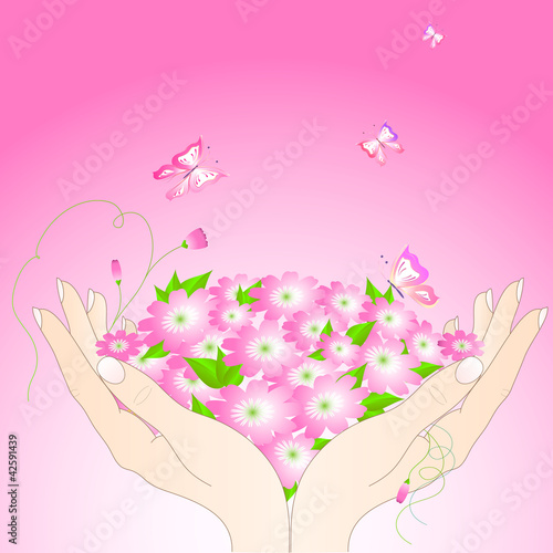 Tender female hands with flowers and butterflies.