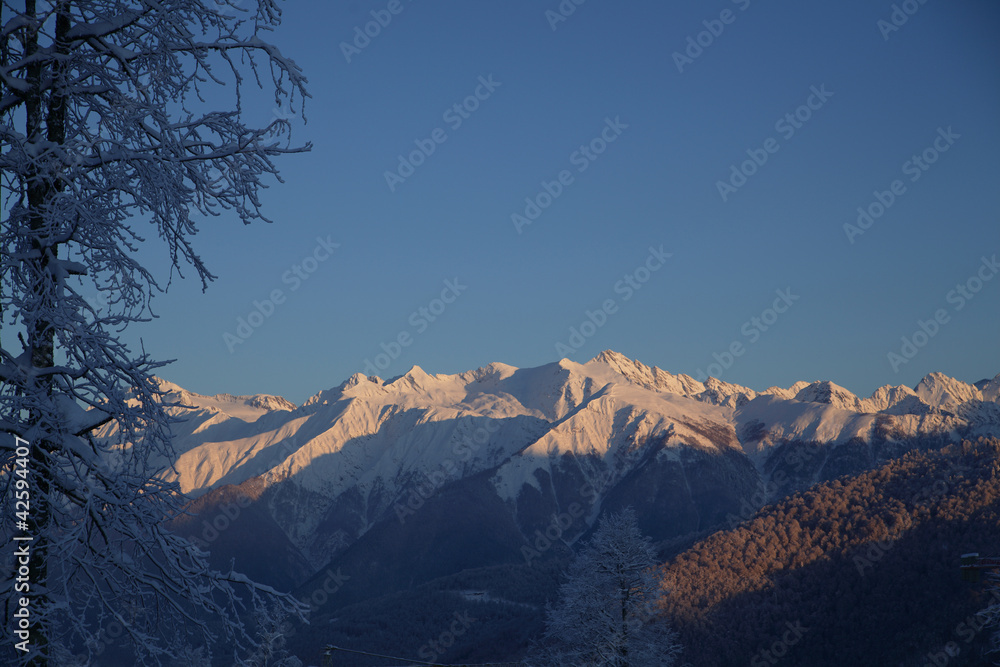 Scenic view of snowy mountains with rich light-and-shadows