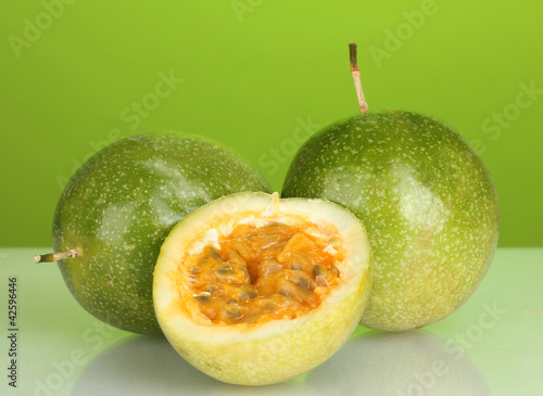 green passion fruit on green background close-up