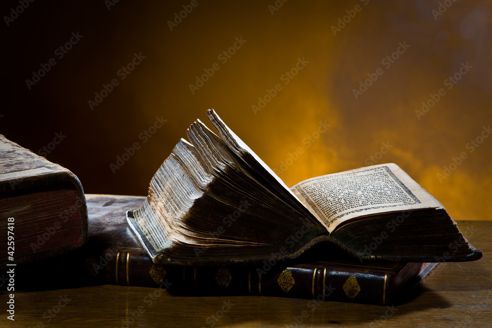 Fototapeta premium Old books in a streak of light