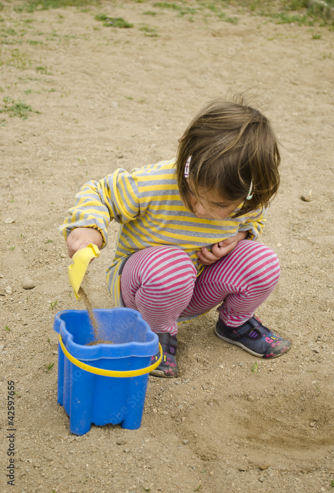 Child playing in the sand Child playing in the sand
