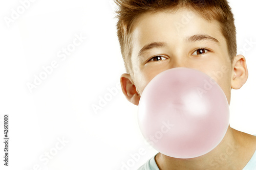 boy make bubble with chew