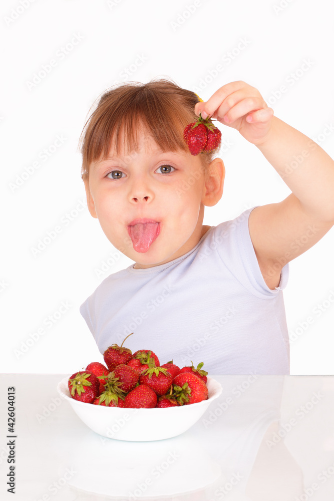 Beautiful little girl with tasty strawberries Beautiful little girl with tasty strawberries