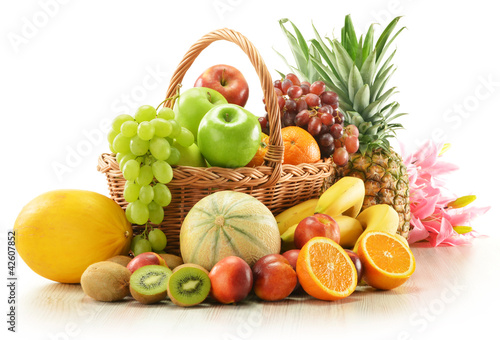 Composition with assorted fruits in wicker basket