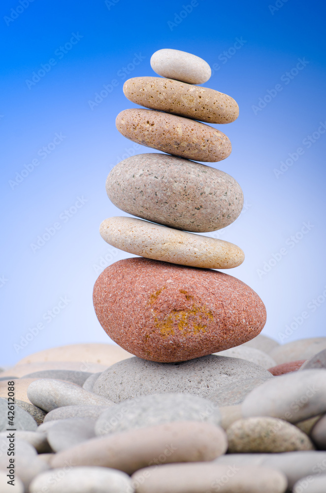 Pebbles stack against gradient background