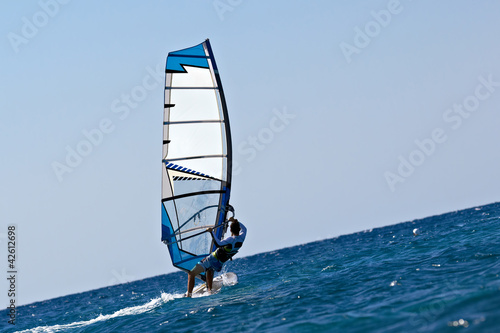Rear view of young windsurfer