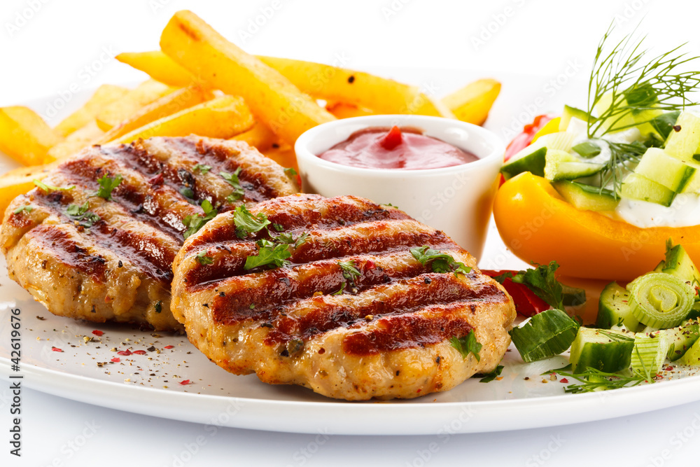 Grilled steak, French fries and vegetables Grilled steak, French fries and vegetables