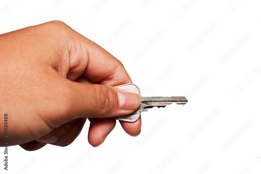 Metal key in right direction on hand isolated on white Metal key in right direction on hand isolated on white