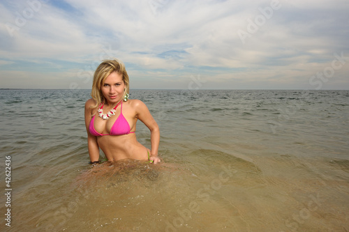 woman at the beach on the water