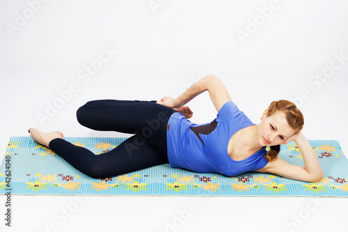 Lovely sporty woman doing stretching exercise