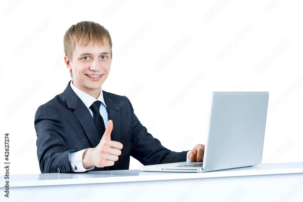 Successful business man in office holding his thumbs up Successful business man in office holding his thumbs up