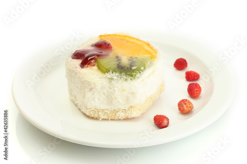 sweet cake with fruits on plate isolated on white