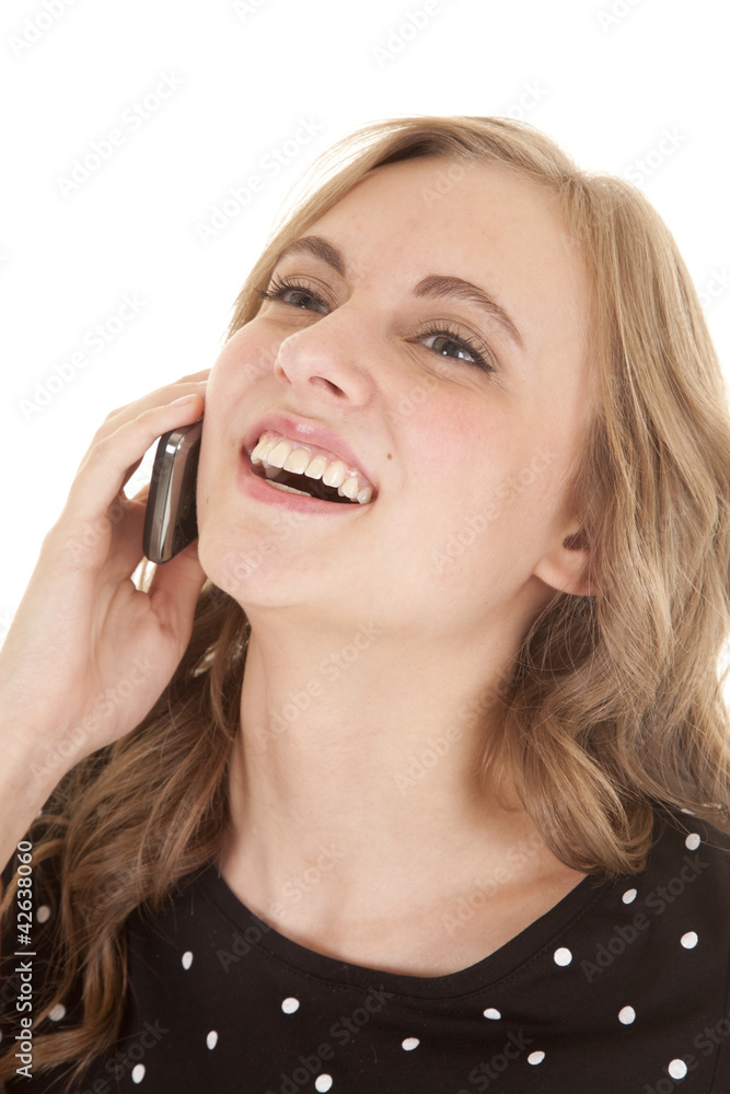 Woman black top dots phone laugh Woman black top dots phone laugh