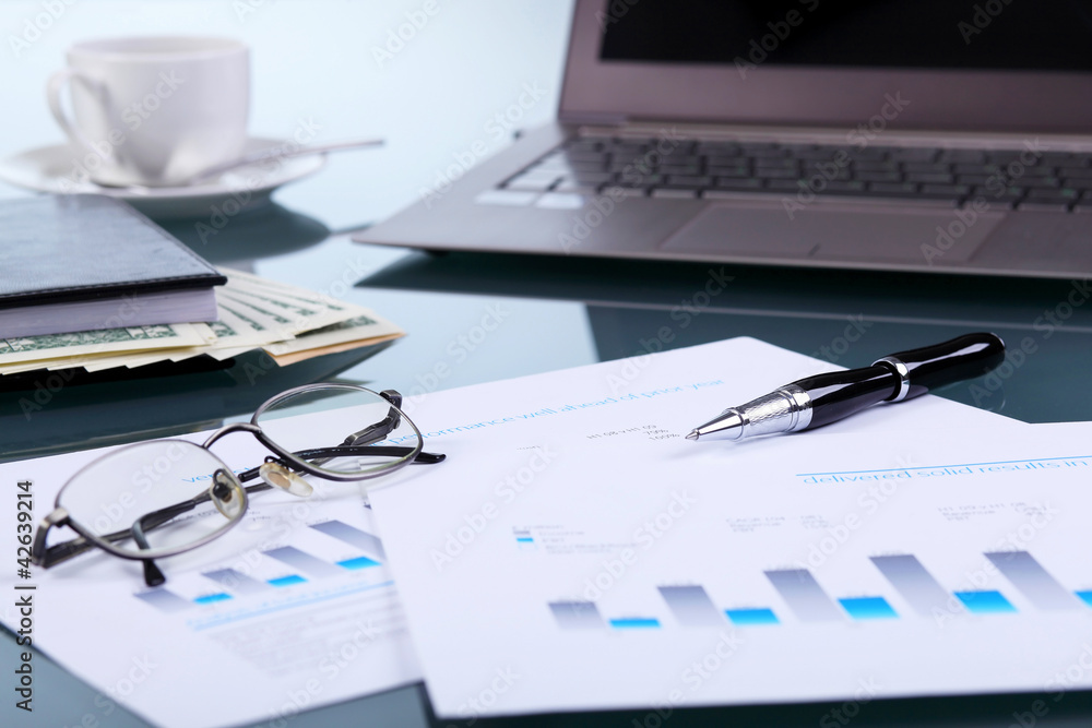 Business papers on the work place Business papers on the work place