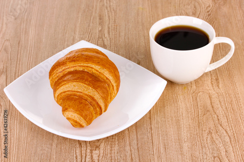 Classical breakfast. Coffee and croissant