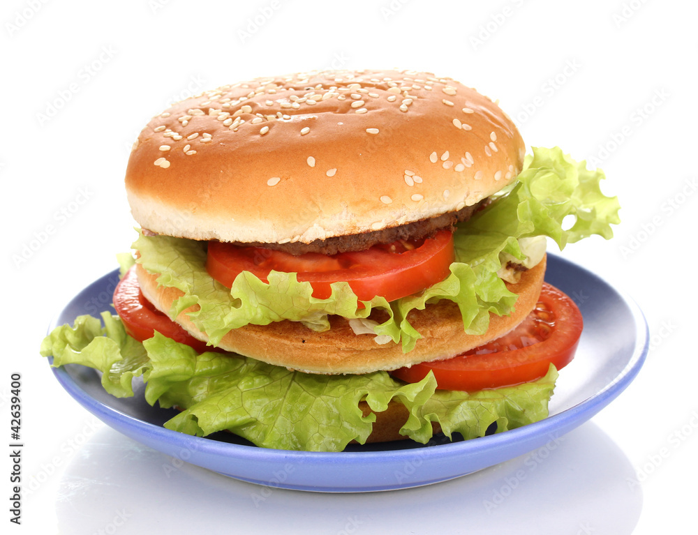 Big and tasty hamburger on plate isolated on white Big and tasty hamburger on plate isolated on white