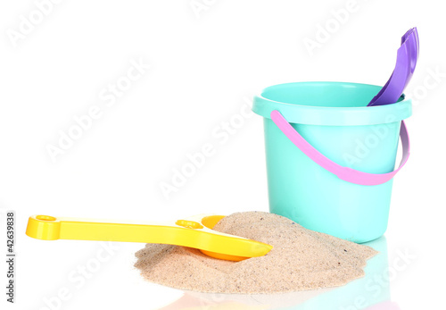 Children s beach toys and sand isolated on white