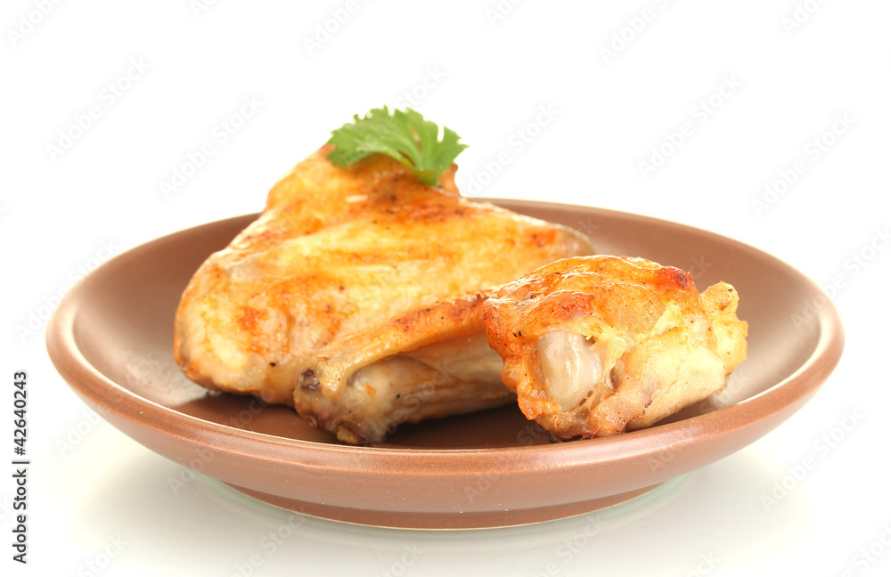 roasted chicken wings with parsley in the plate isolated
