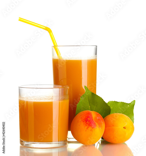 two glasses of apricot juice and apricots with leaf isolated