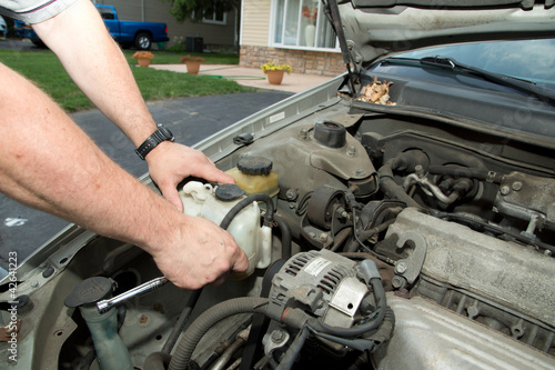 Mechanic fixing car