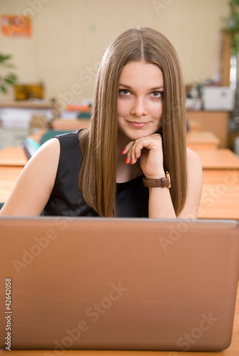 Young pretty business woman with notebook.