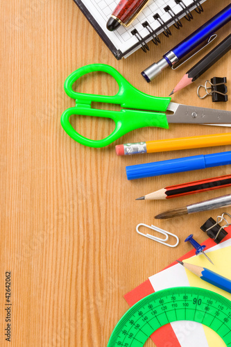 back to school concept and supplies on wood