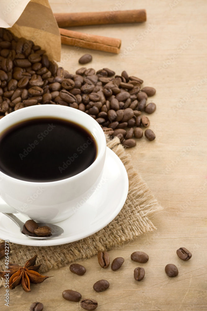 cup of coffee with beans and paper cup of coffee with beans and paper