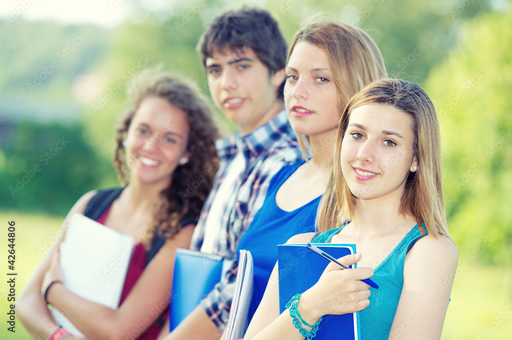 Portrait happy young students in park Portrait happy young students in park