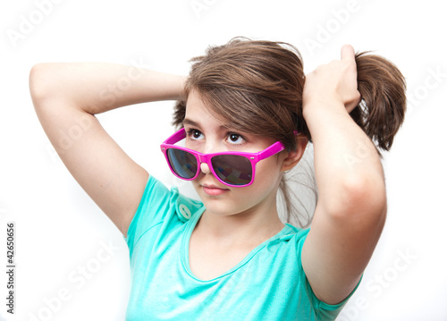 young teenager with sunglasses and attitude.Isolated on white