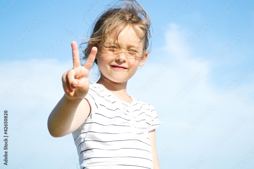 Fototapeta premium girl shows a hand sign