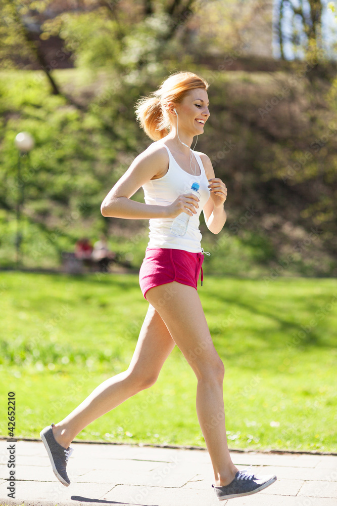 Young woman jogging in park