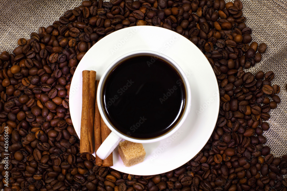 Coffee beans and white cup Coffee beans and white cup