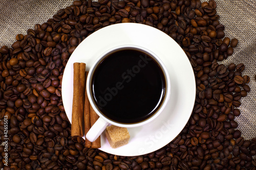 Coffee beans and white cup