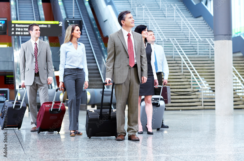 Group of business people at the airport. Group of business people at the airport.