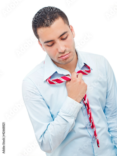 Tired young businessman, isolated on white photo