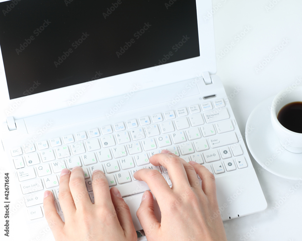 Human hands working on laptop on office background Human hands working on laptop on office background