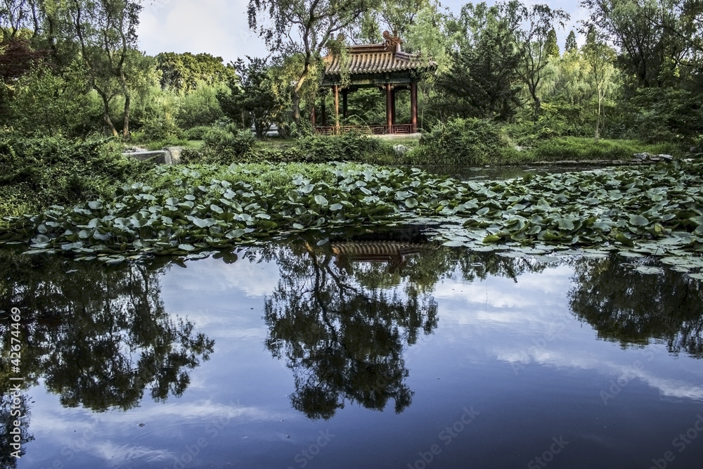 Chinese Pavilion reflected in a pond in Nanjing China Chinese Pavilion reflected in a pond in Nanjing China