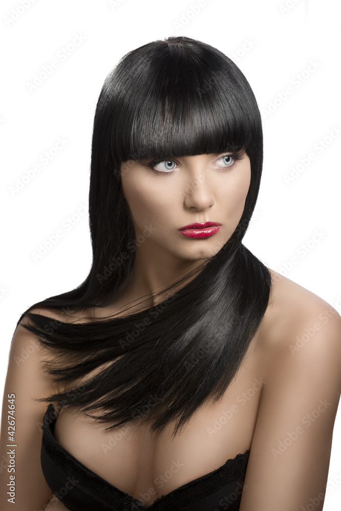 Naklejka premium girl's portrait with long dark hair, she looks at left