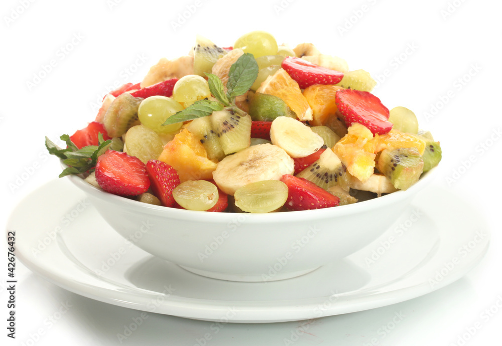 bowl with fresh fruits salad  isolated on white