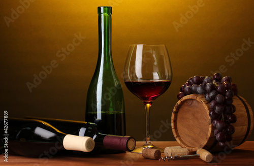 In wine cellar. Composition of wine bottles and runlet photo