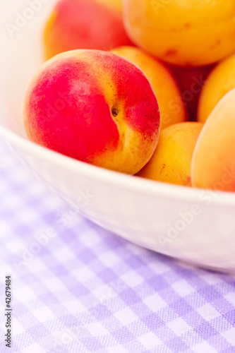 bowl of fresh apricots cherries