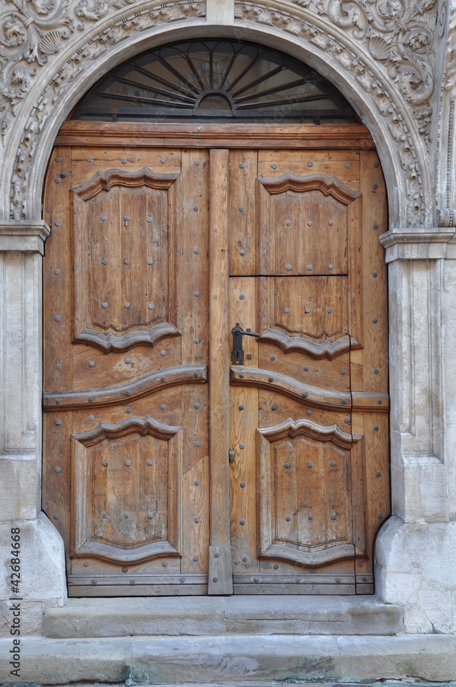 Old wooden door to the townhouse